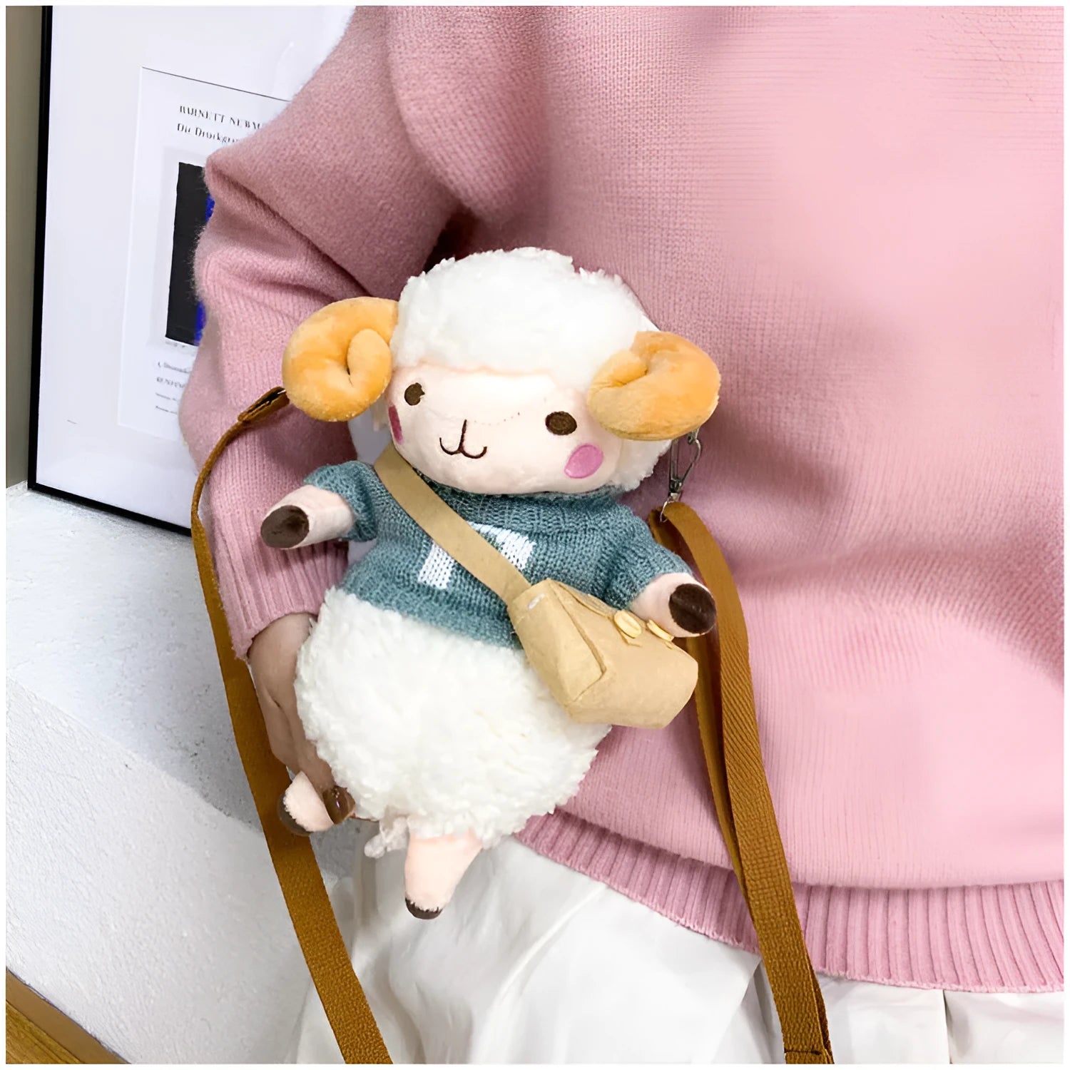 Little Sheep plush crossbody bag in blue with lamb pattern, showing small square shape and soft handle
