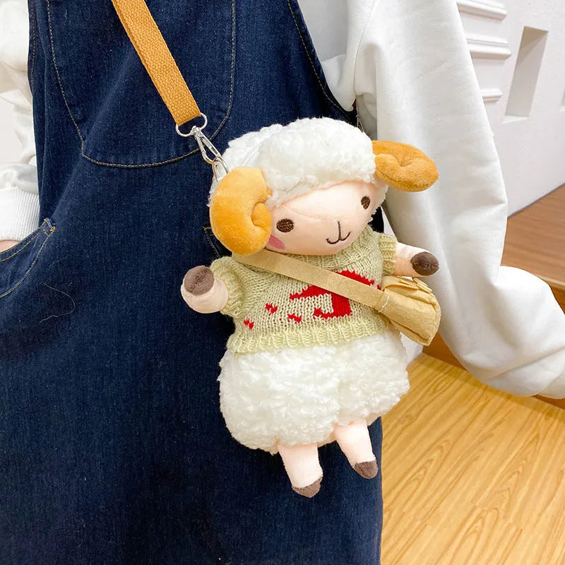Little Sheep plush crossbody bag in blue with lamb pattern, showing small square shape and soft handle