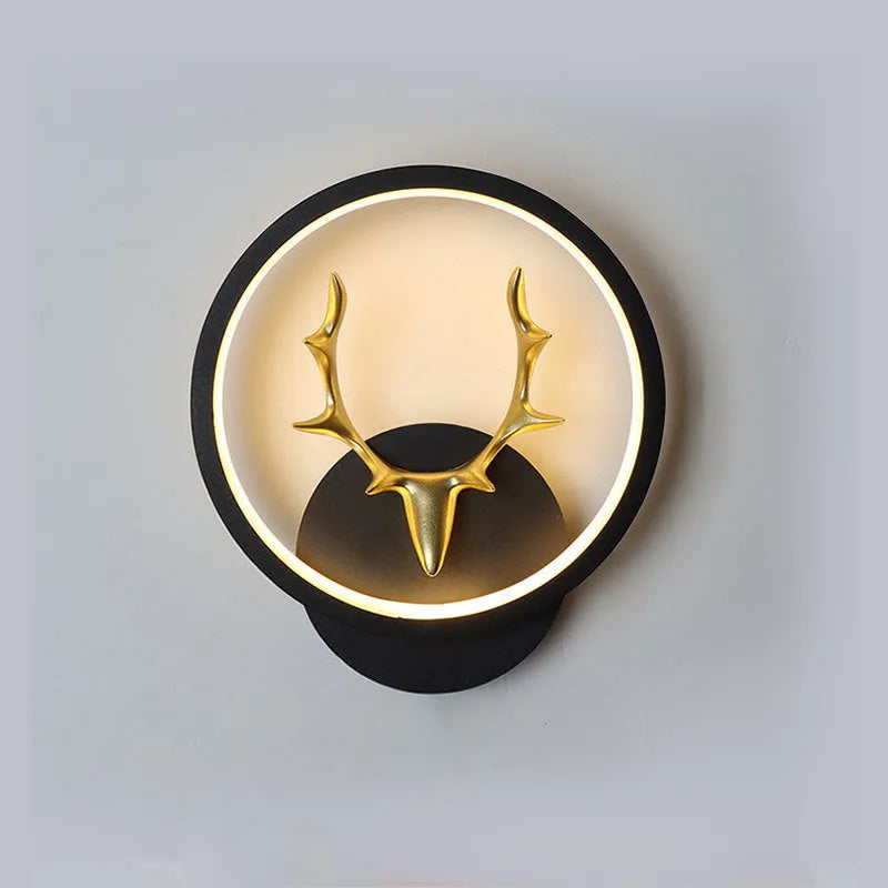 Deer antler shaped wall light with remote control on a plain wall, showing white and black colour options.