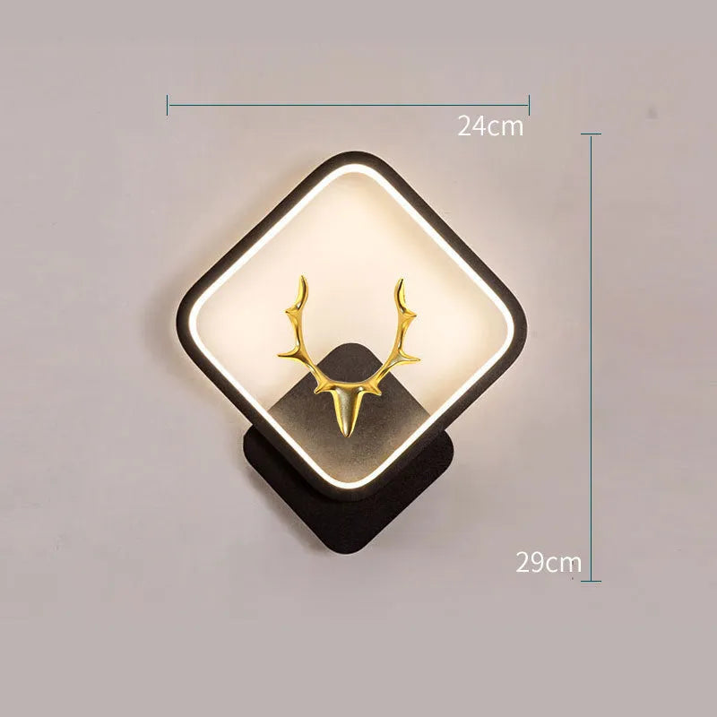 Deer antler shaped wall light with remote control on a plain wall, showing white and black colour options.