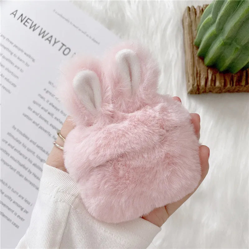 Pink rabbit ear silicone cover on Apple AirPods wireless headphones