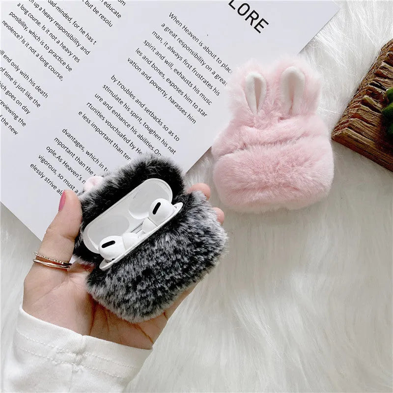 Pink rabbit ear silicone cover on Apple AirPods wireless headphones