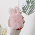 Pink rabbit ear silicone cover on Apple AirPods wireless headphones