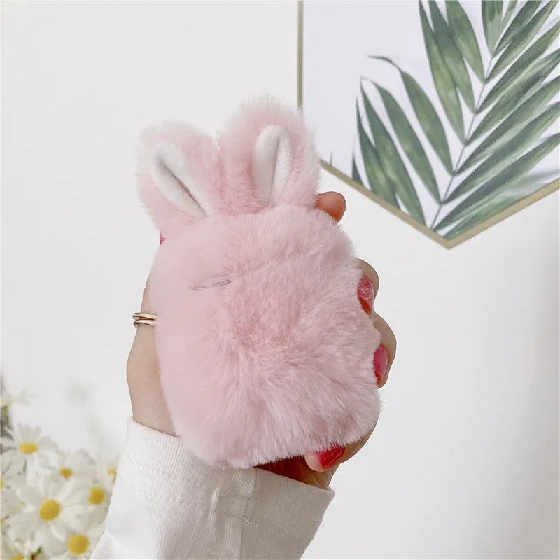 Pink rabbit ear silicone cover on Apple AirPods wireless headphones