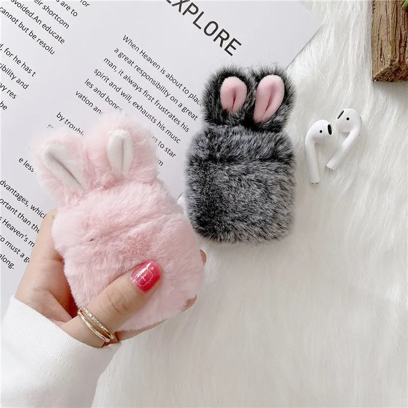 Pink rabbit ear silicone cover on Apple AirPods wireless headphones