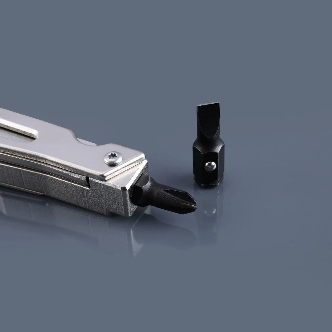 White stainless steel multi-function tool with wrench, knife blade, and needle nose pliers