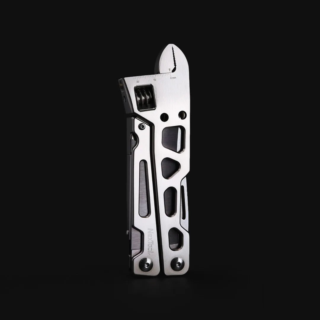 White stainless steel multi-function tool with wrench, knife blade, and needle nose pliers
