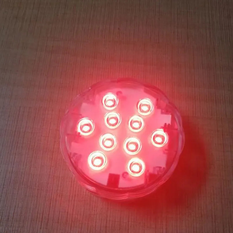 White IP68 waterproof remote control diving light with LED beads for pools and gardens.