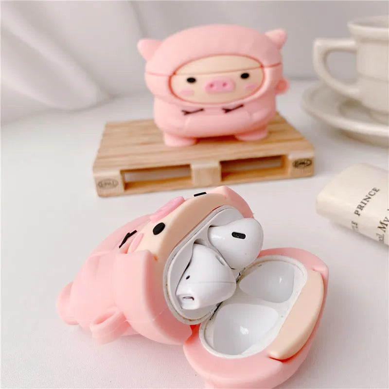 Pink silicone AirPods case with cartoon pig design, flip cover, and carrying hook compatible with Apple AirPods 1, 2, and Pro