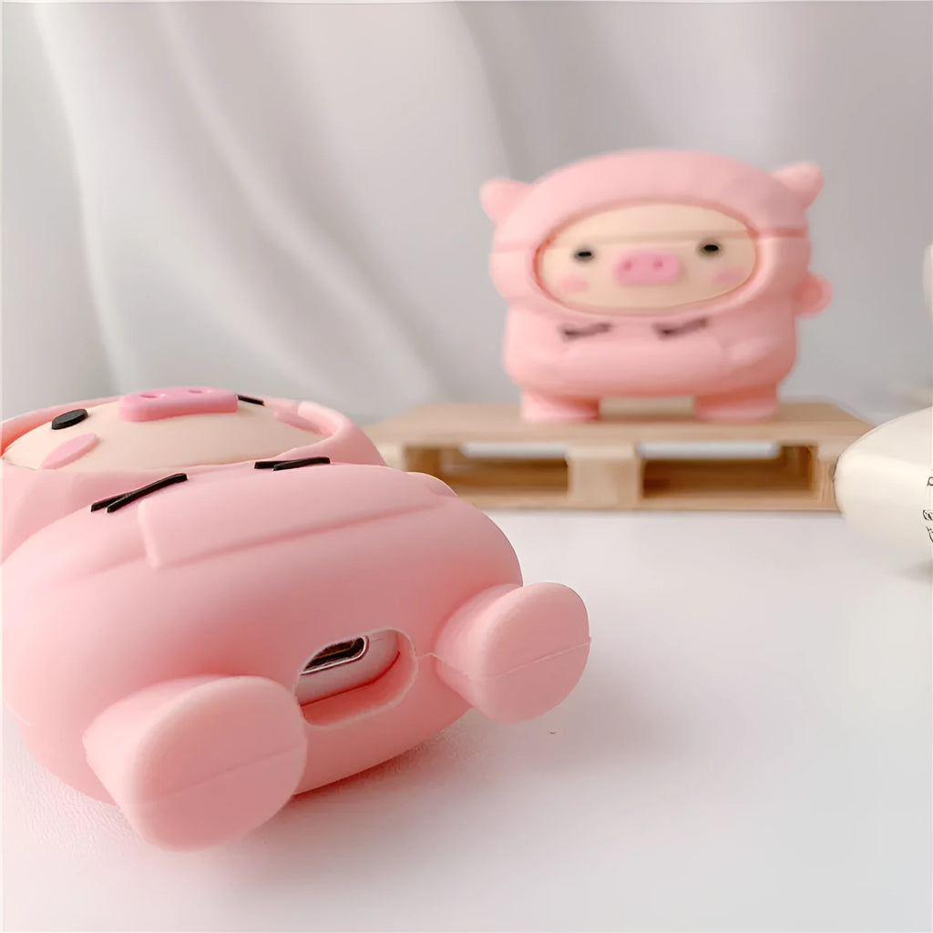 Pink silicone AirPods case with cartoon pig design, flip cover, and carrying hook compatible with Apple AirPods 1, 2, and Pro