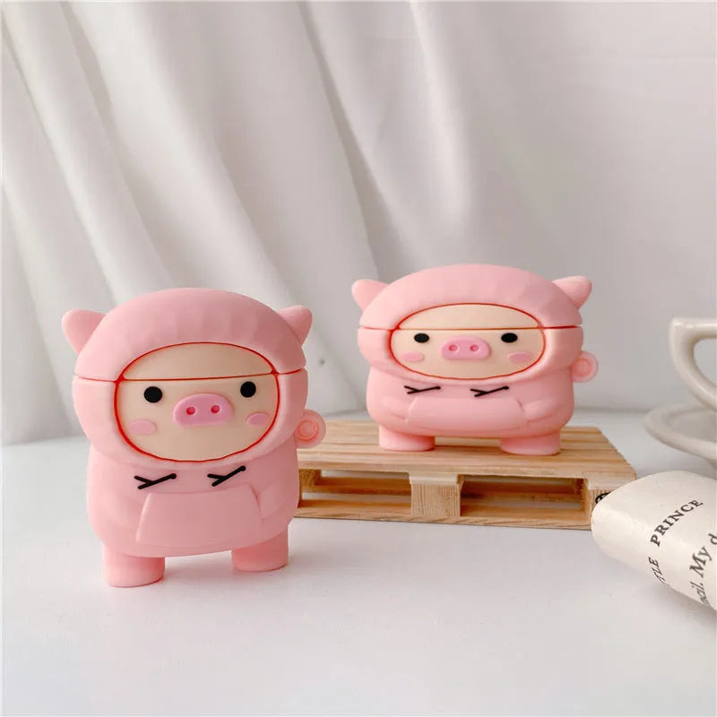 Pink silicone AirPods case with cartoon pig design, flip cover, and carrying hook compatible with Apple AirPods 1, 2, and Pro