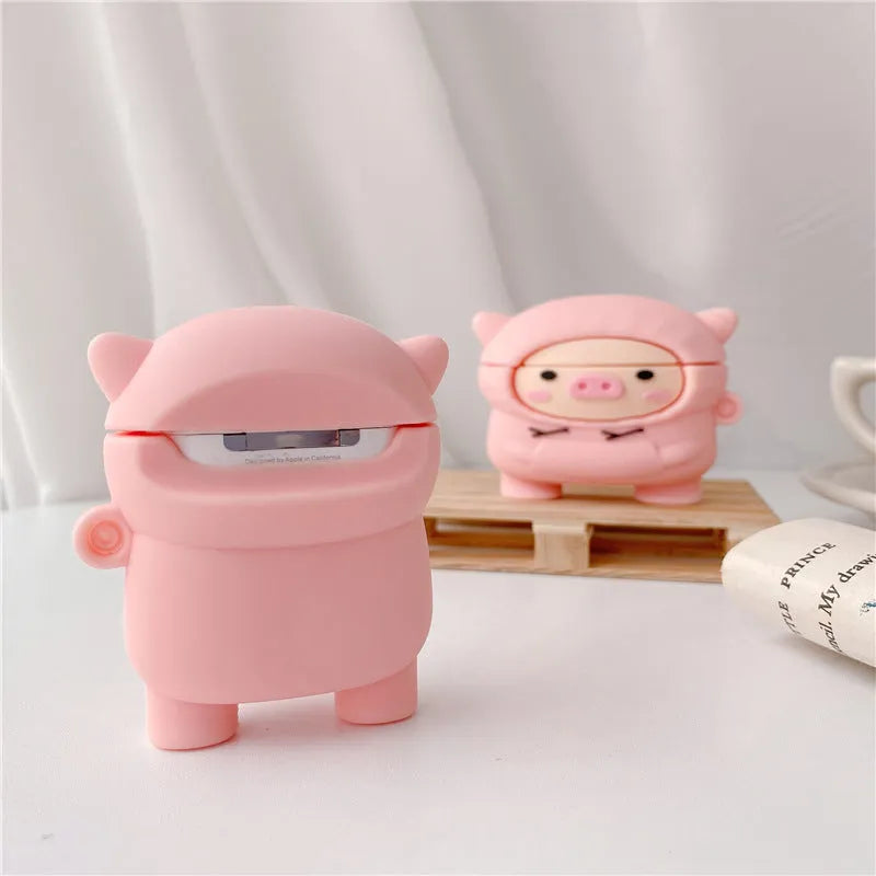 Pink silicone AirPods case with cartoon pig design, flip cover, and carrying hook compatible with Apple AirPods 1, 2, and Pro