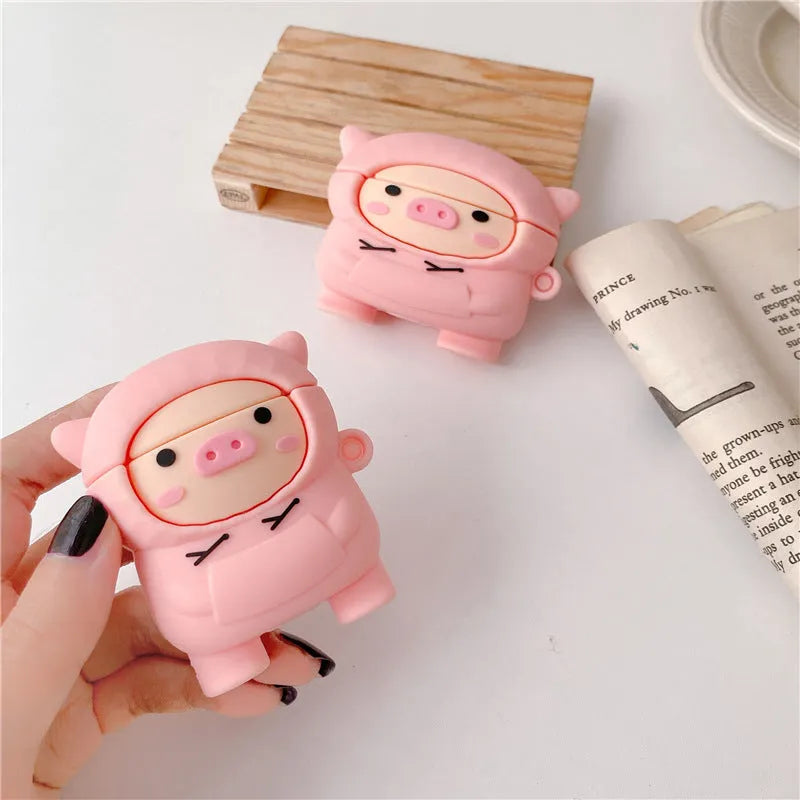 Pink silicone AirPods case with cartoon pig design, flip cover, and carrying hook compatible with Apple AirPods 1, 2, and Pro