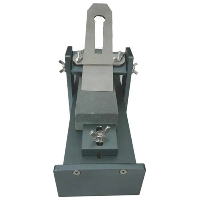 Fixed angle sharpening tool for woodworking chisels and planers on a workshop bench