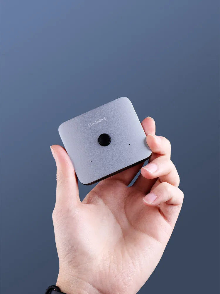 Grey Haibeisi HDMI switcher splitter device with multiple HDMI ports for 4K video sharing.