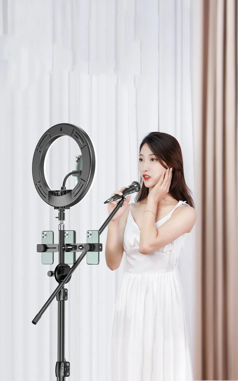 Carbon alloy mobile phone live tripod with true carbon steel bracket, selfie remote, and 10 inch lamp on white background