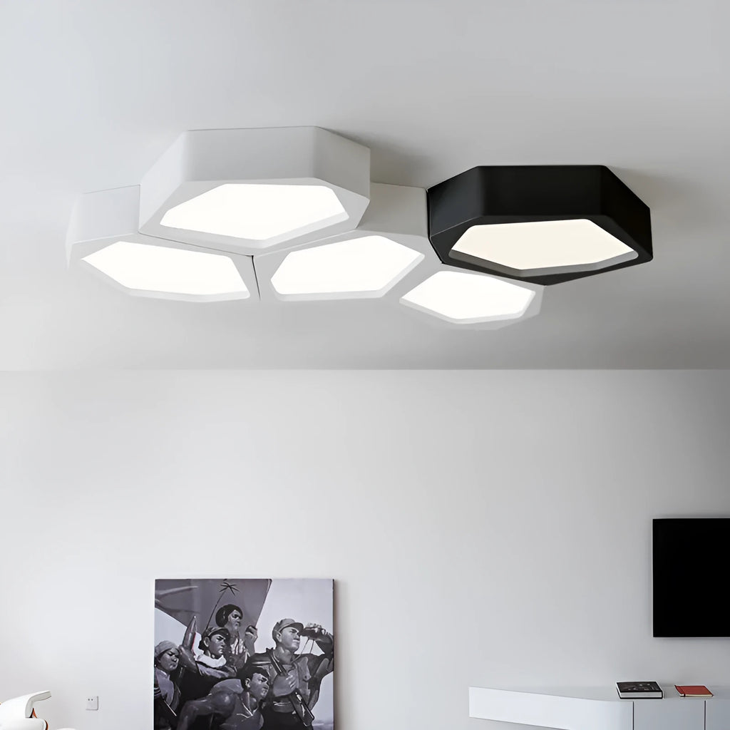 Geometric shaped LED wall light in black frame with three colour modes for living room or bedroom