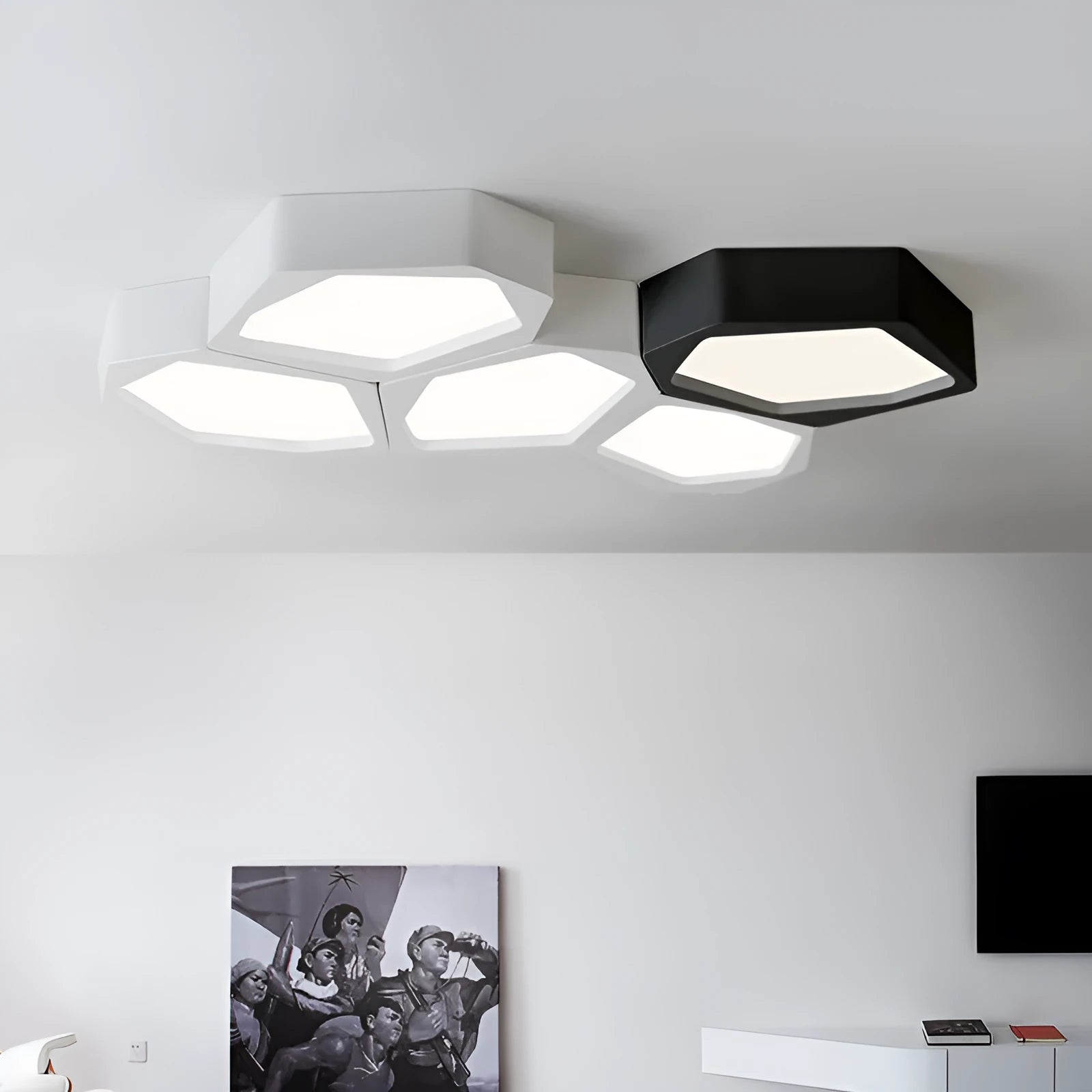 Geometric shaped LED wall light in black frame with three colour modes for living room or bedroom