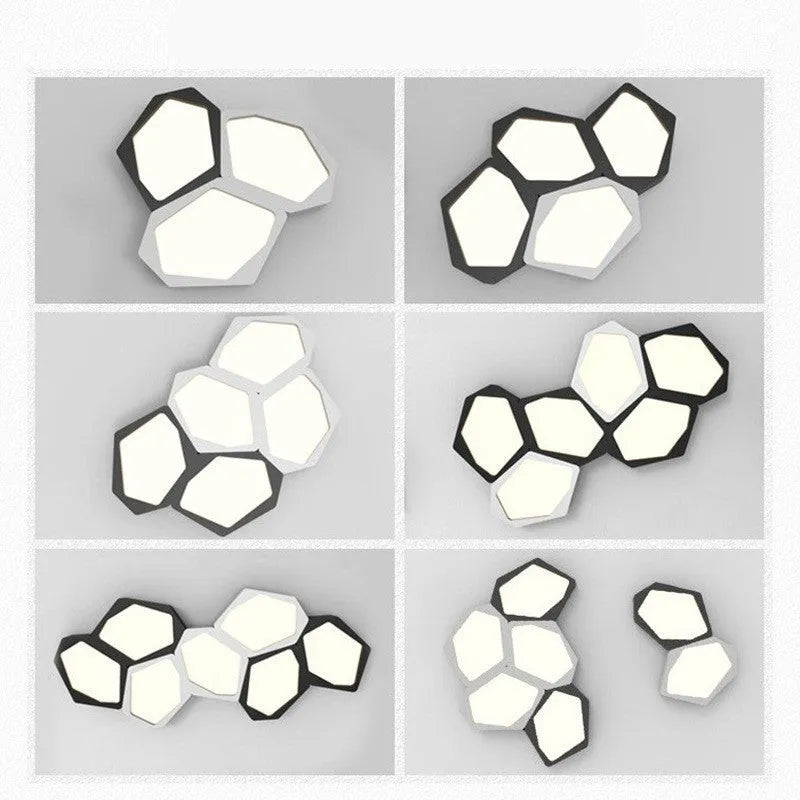 Geometric shaped LED wall light in black frame with three colour modes for living room or bedroom