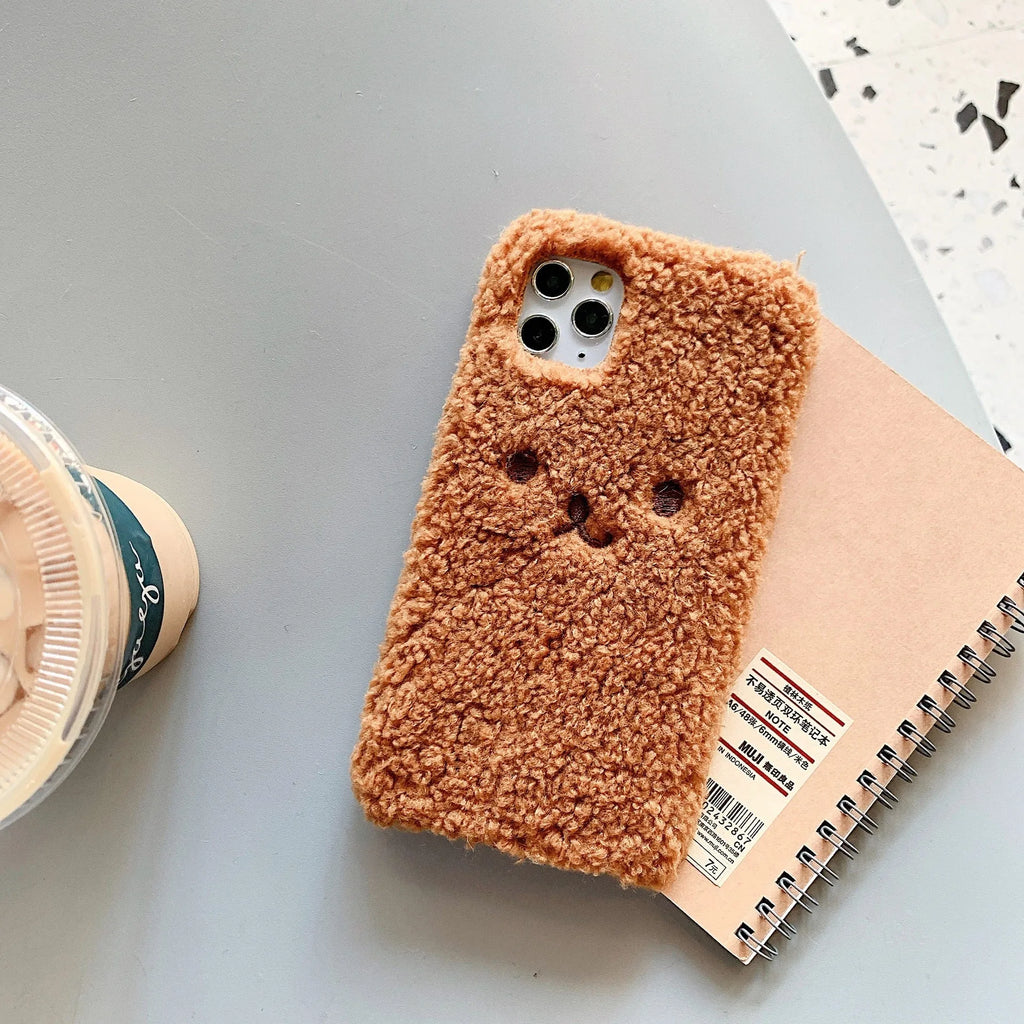 Embroidered brown plush bear cartoon design on a white TPU iPhone case for iPhone 11.