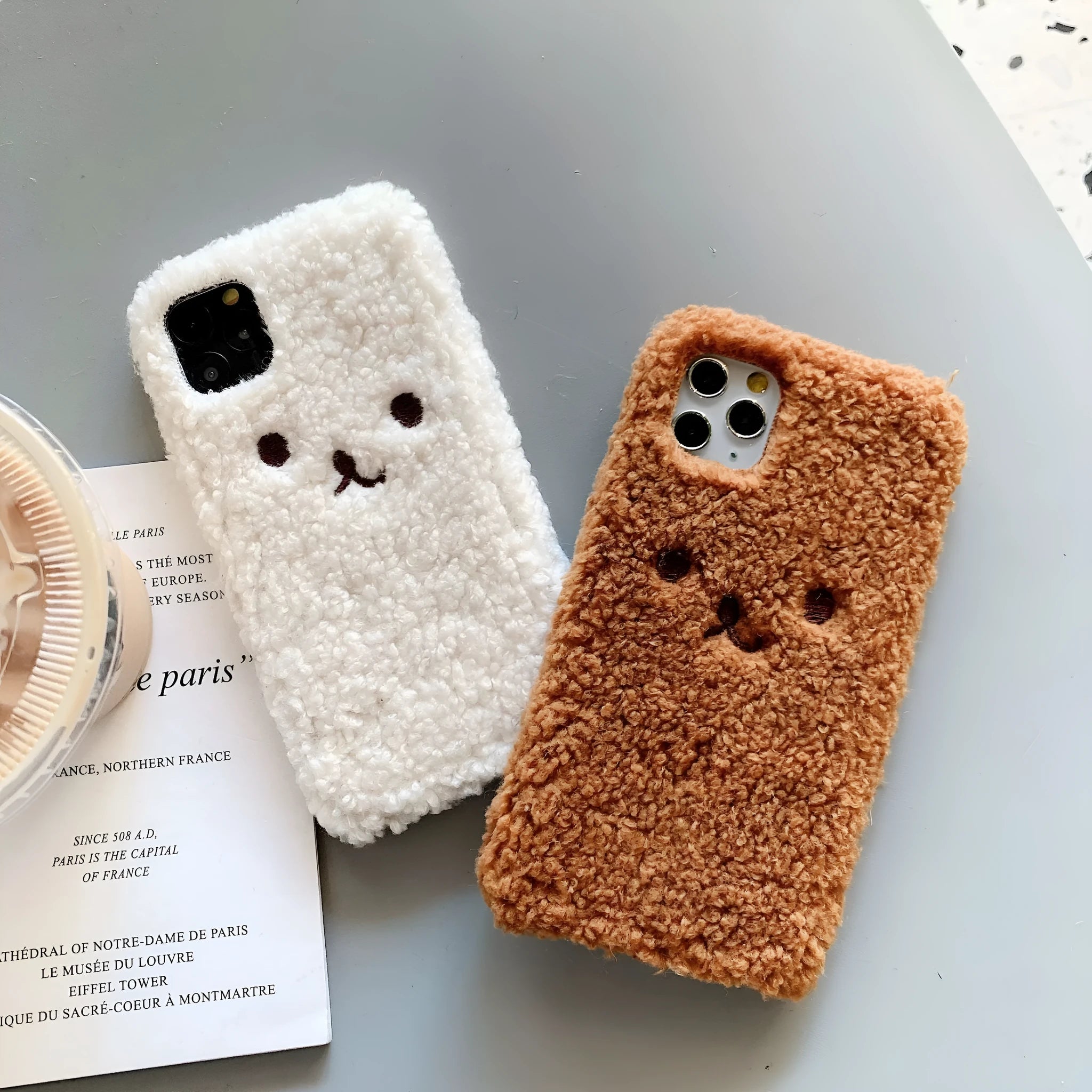 Embroidered brown plush bear cartoon design on a white TPU iPhone case for iPhone 11.