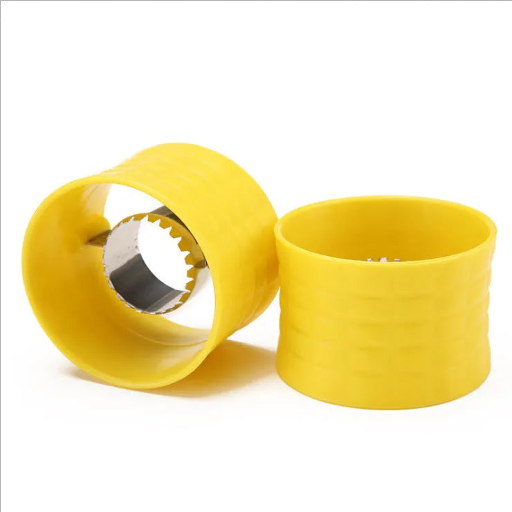 Yellow manual corn thresher kitchen tool with a corn-kernel-shaped plastic handle.