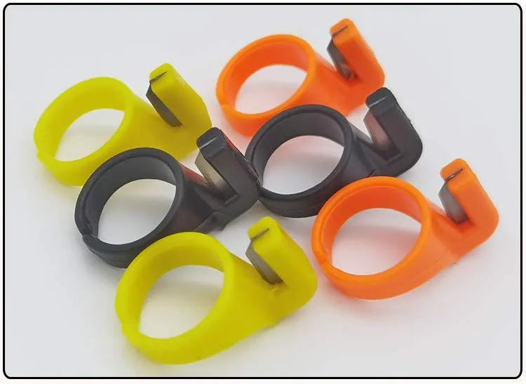 Three seam ripper ring knives in black, orange, and yellow with carbon steel blades and ABS plastic handles
