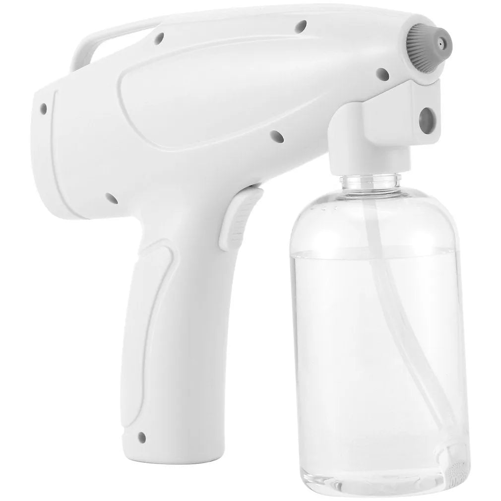 White cordless handheld disinfectant spray gun with USB-C charging port and bottle attached.