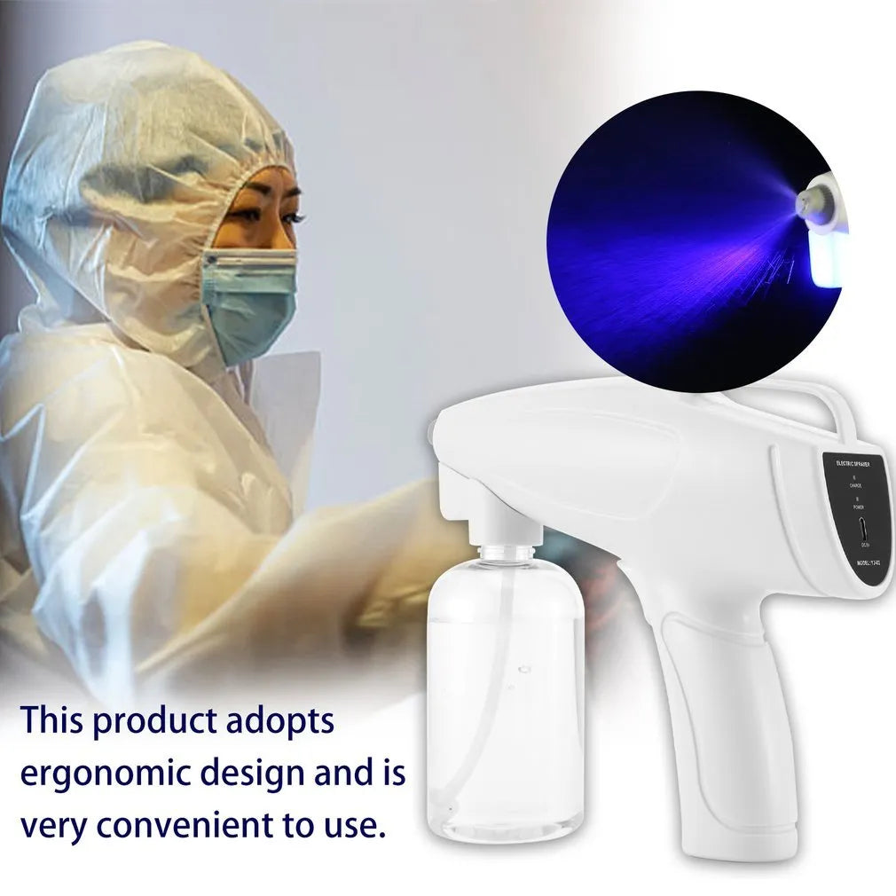 White cordless handheld disinfectant spray gun with USB-C charging port and bottle attached.