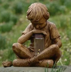 Brown natural resin little boy tabletop decoration figurine on shelf