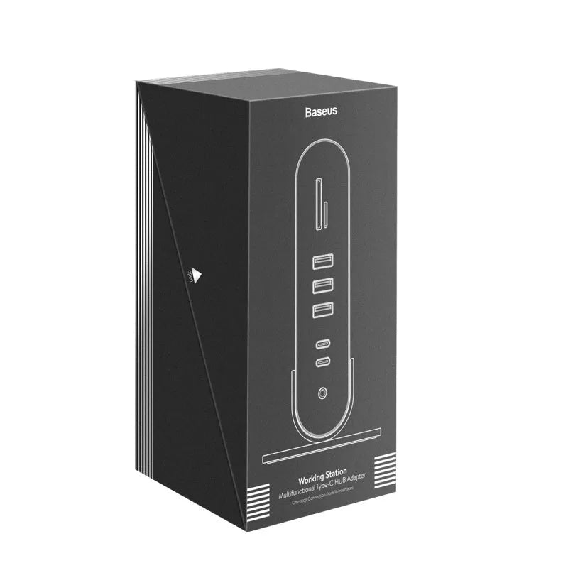 Deep space grey 16-in-1 USB-C docking station hub with multiple ports and external power supply on a desk.