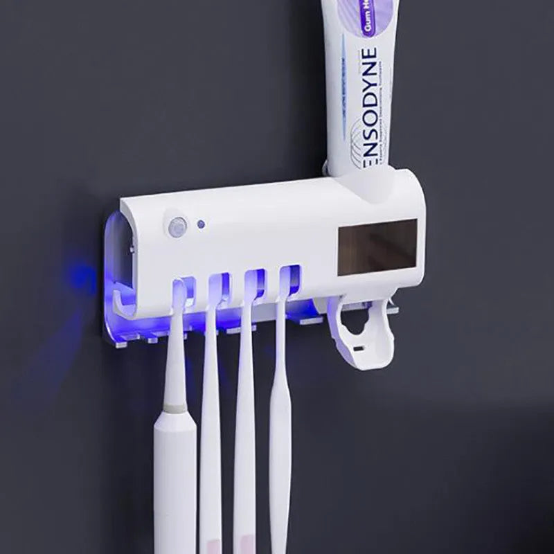 Black wall-mounted UV toothbrush steriliser with automatic toothpaste dispenser and solar panel.