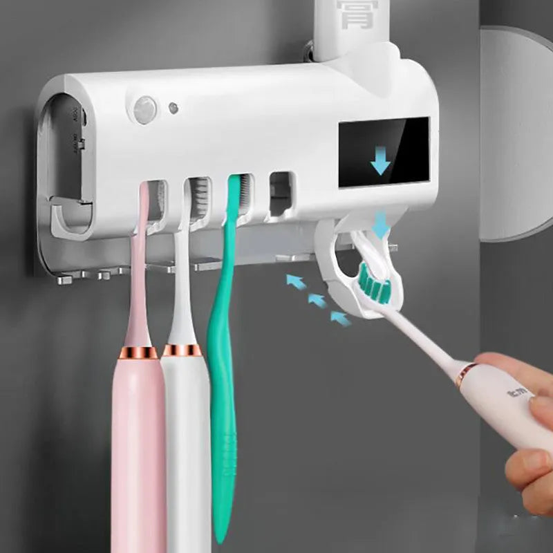 Black wall-mounted UV toothbrush steriliser with automatic toothpaste dispenser and solar panel.