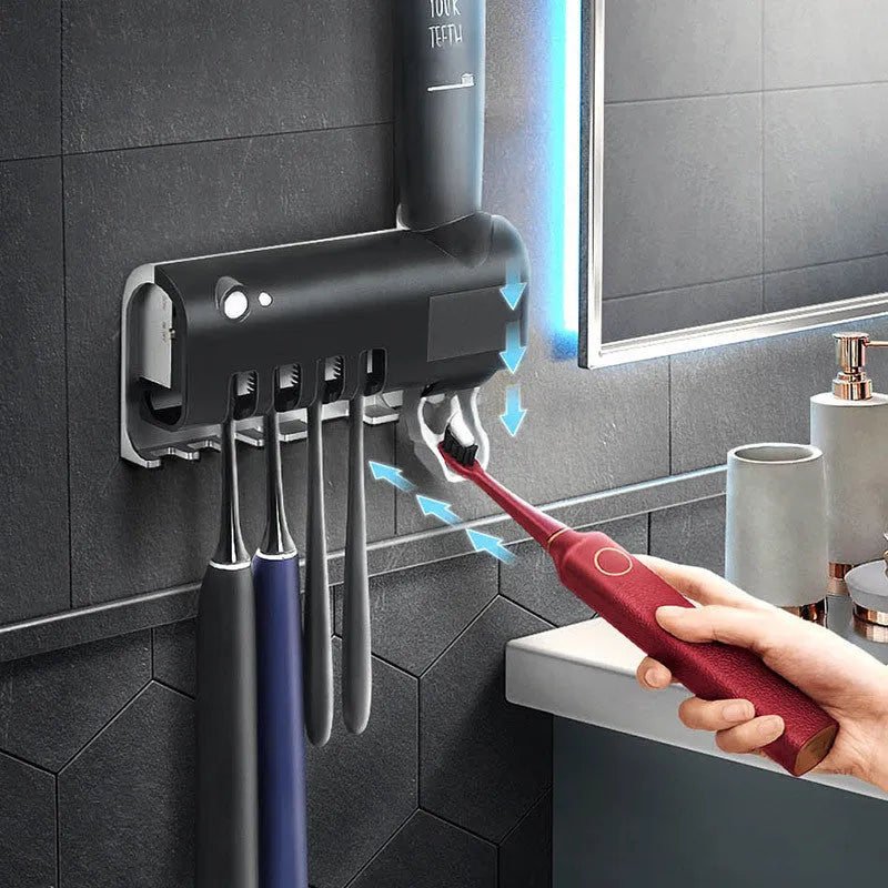 Black wall-mounted UV toothbrush steriliser with automatic toothpaste dispenser and solar panel.