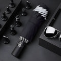 Black automatic reverse umbrella shown open with reflective cloth and 10-rib construction
