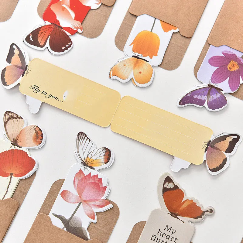 Butterfly-shaped paper bookmark from Fun Dream, showing random colour design.