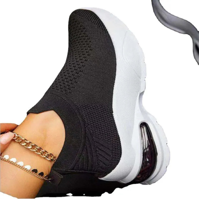 Women's white mesh sneakers with rubber sole, flat heel, and round toe for daily casual wear