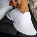 Women's white mesh sneakers with rubber sole, flat heel, and round toe for daily casual wear