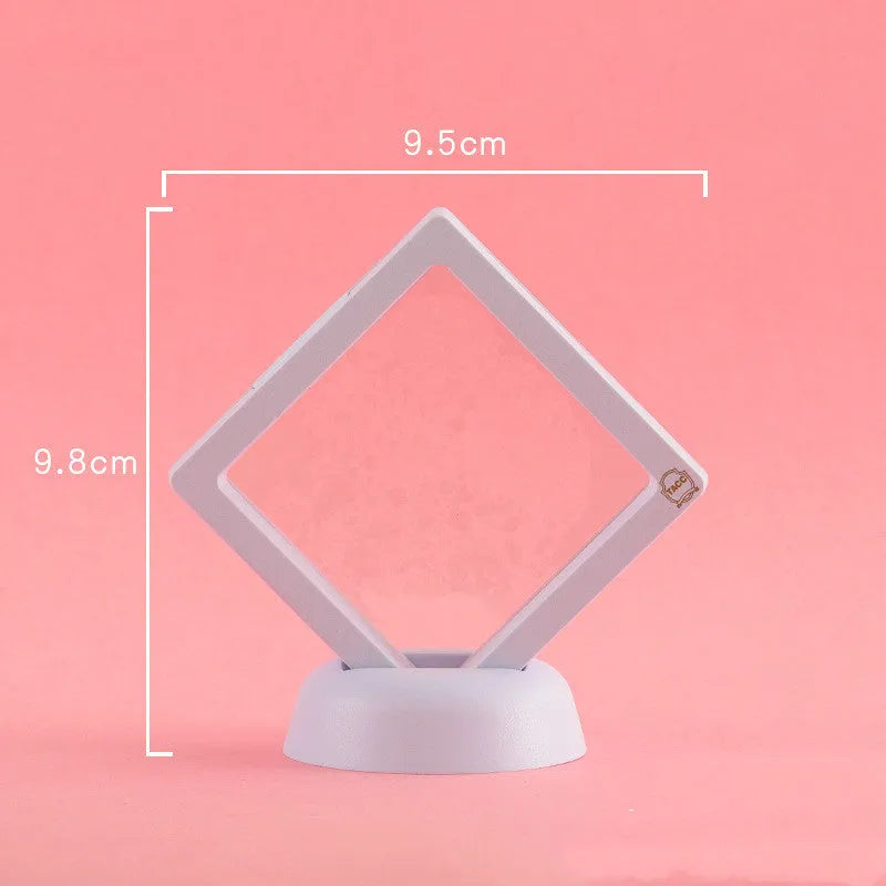 Transparent 3D floating display case holding a coin, with black and white size options