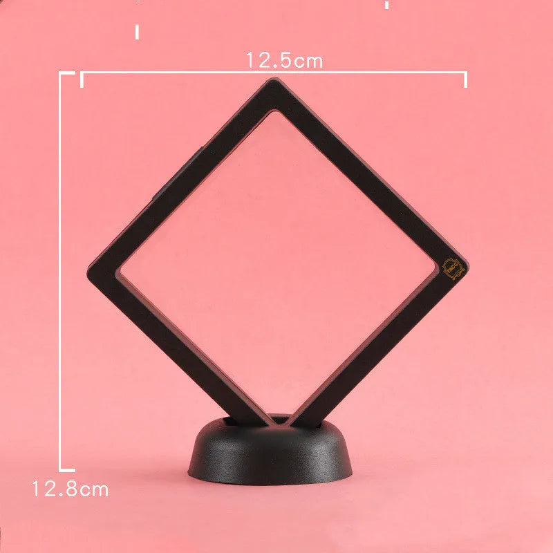 Transparent 3D floating display case holding a coin, with black and white size options