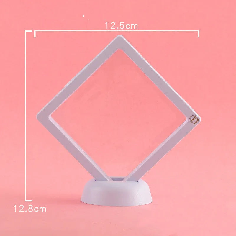 Transparent 3D floating display case holding a coin, with black and white size options