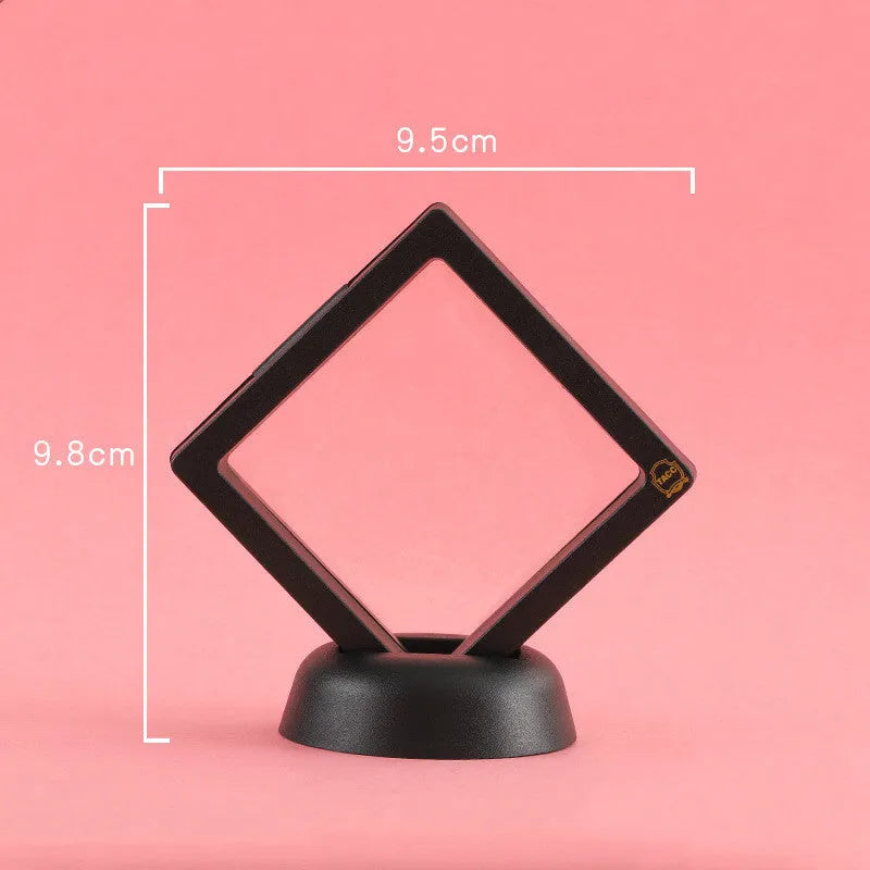Transparent 3D floating display case holding a coin, with black and white size options