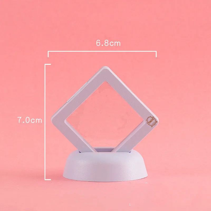 Transparent 3D floating display case holding a coin, with black and white size options