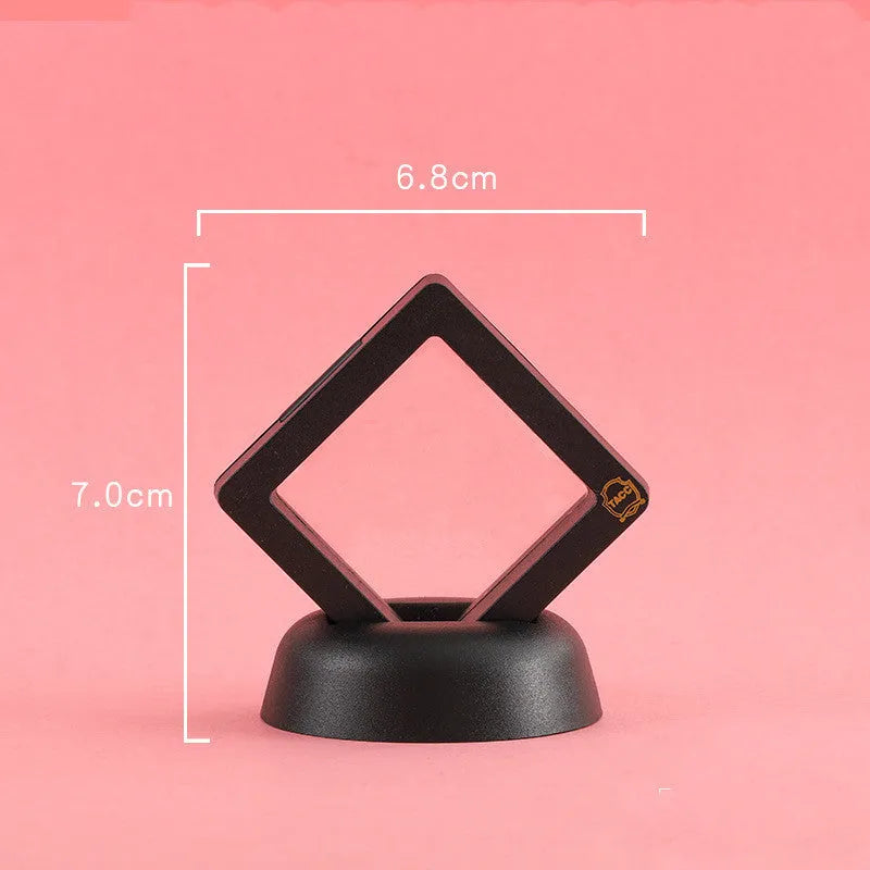 Transparent 3D floating display case holding a coin, with black and white size options