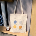 Women's canvas tote bag with geometric print and double shoulder straps