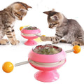 Rotating turntable cat toy with transparent catnip compartment and suction cup base