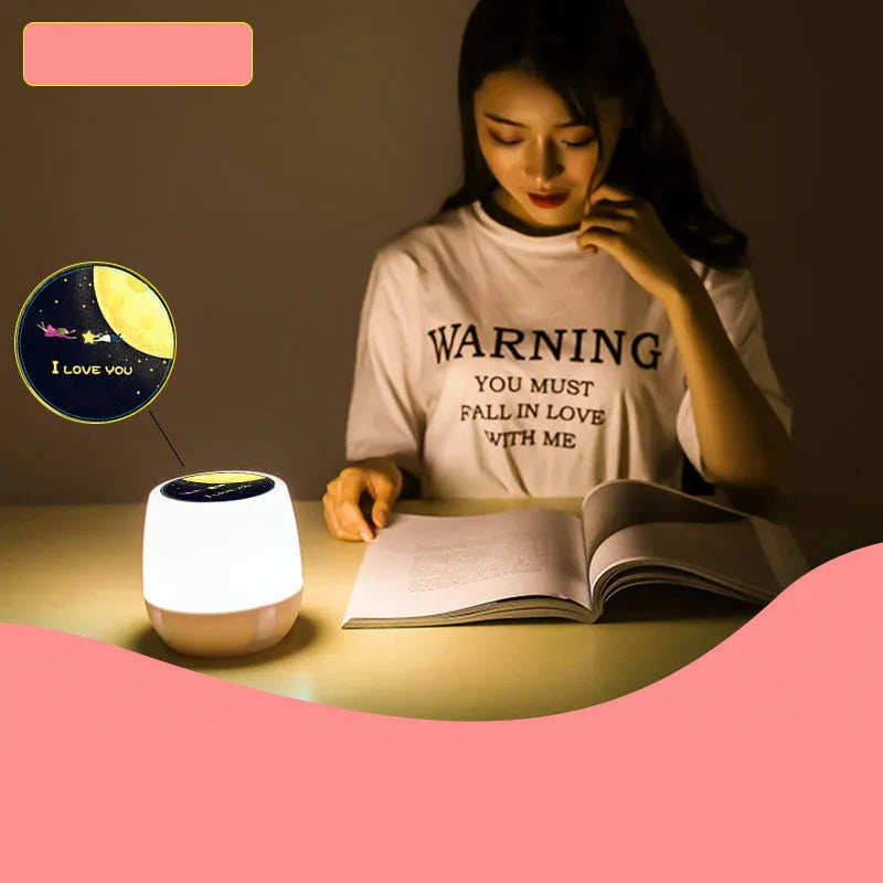Pruixin rotating projector night light showing starry night pattern projection on a wall.