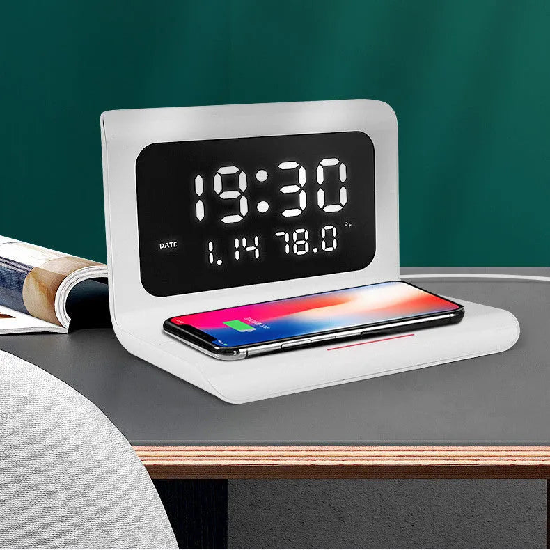 White wireless charging pad with digital clock showing time, date, temperature and humidity display.