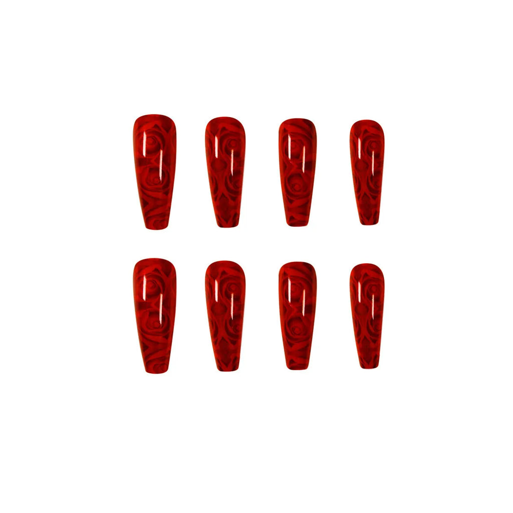 Hot wine red rose wearing nail art finished product set with 24 tablets and glue on white background