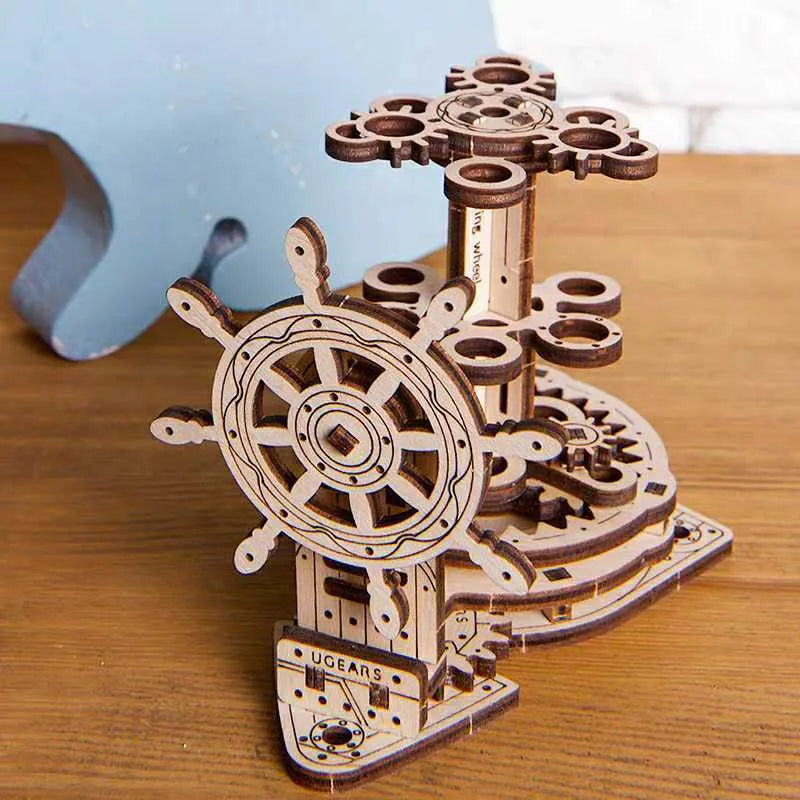 Ukrainian wooden rotating pen holder model with steering wheel on desk